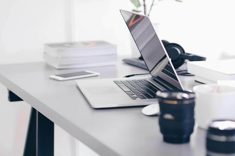 Rachel Jackson Marketing Tech Specialist. a minimalist picture of an office desk with a laptop on it.